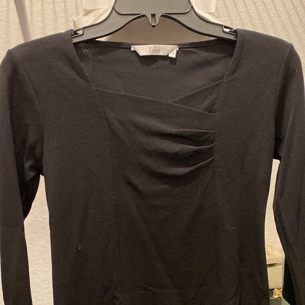 Black shirt, long sleeved with slight V-Neck. British brand. Comfortable fit.
